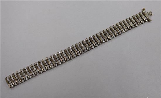 A 9ct gold and diamond set multi line bracelet with forty rows of five small diamonds, total carat weight 2.00cts, 18cm.